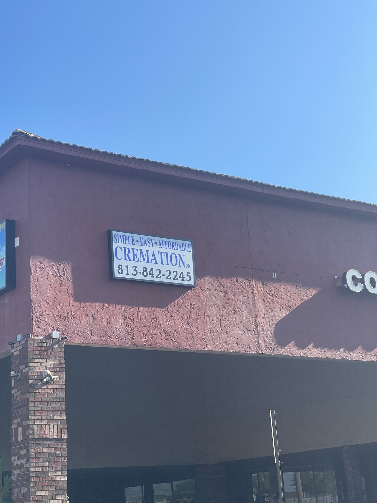 Sign says “Simple. Easy. Affordable. Cremation”